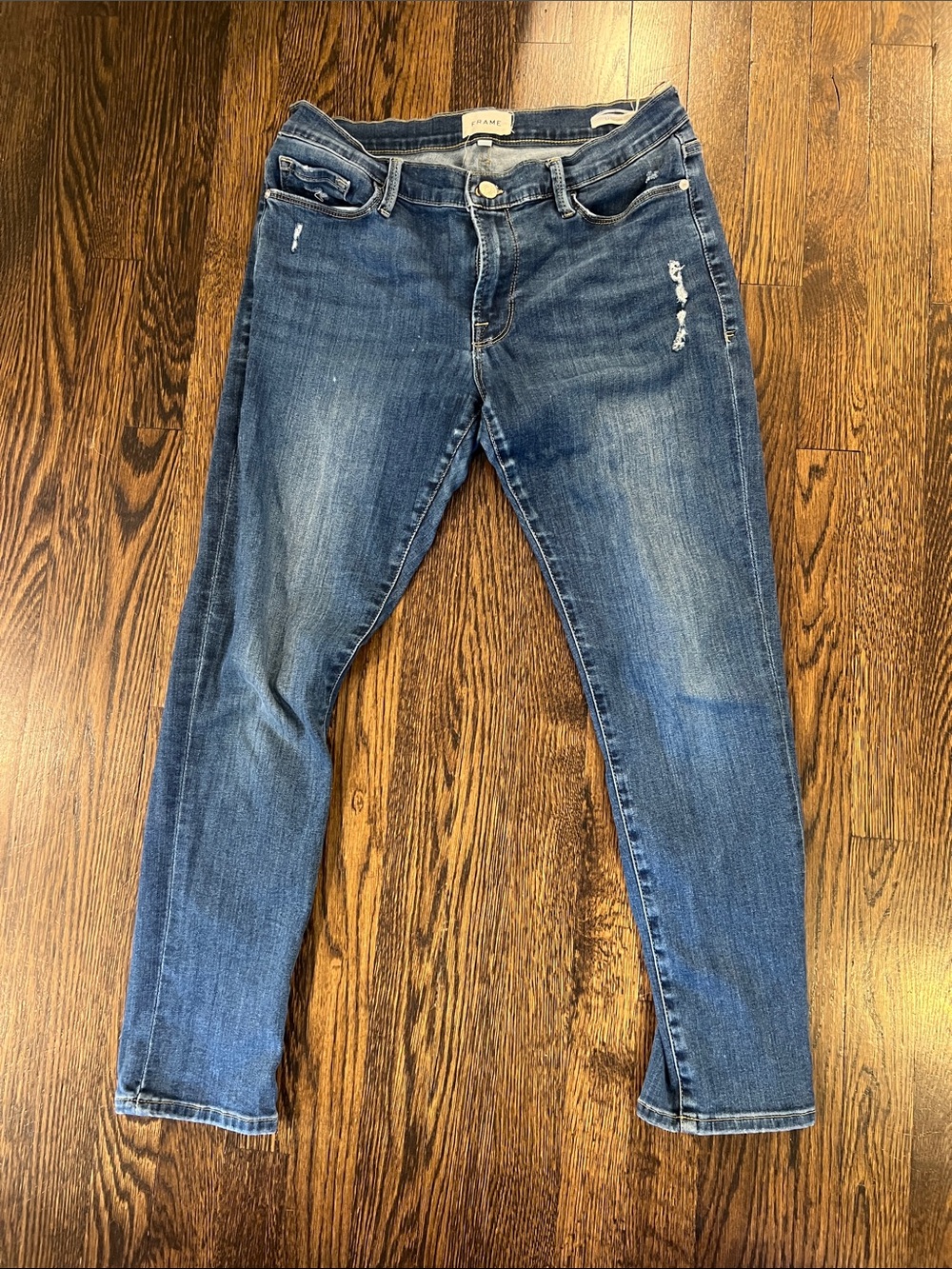 Frame Denim Medium Wash Skinny Jeans with Light Distressing